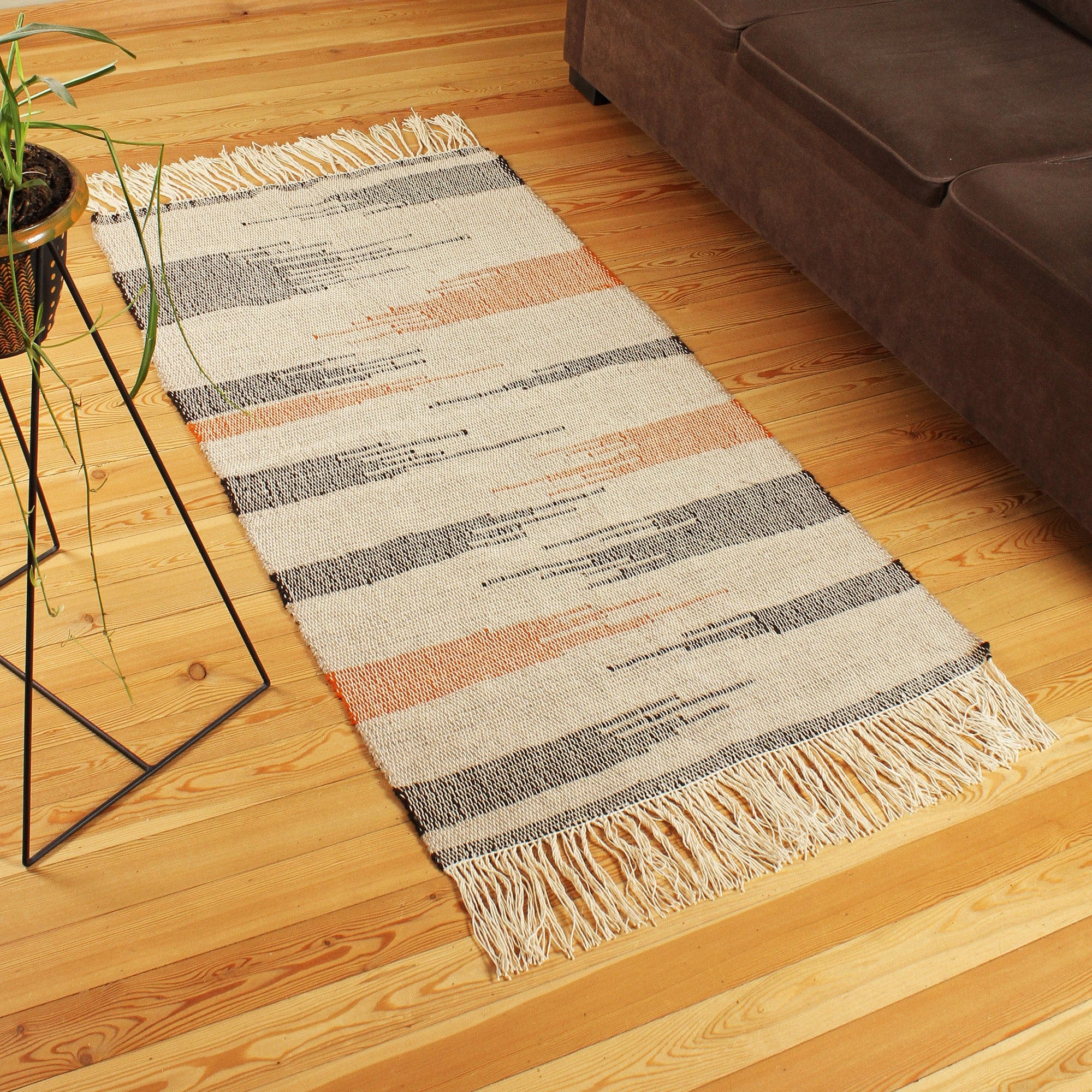 Handwoven Black and Orange Wool Area Rug (2.5x5) - Paths on Beige